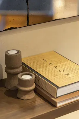 a table with two books and two rolls of paper at Wabi-Sabi Hôtel Lorrain in Nice
