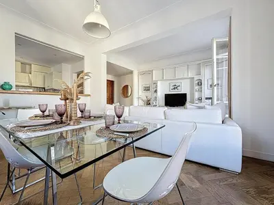 a living room with a white couch and a glass table at Large 2 bedroom apartment, Close to Promenade des Anglais in Nice