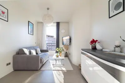 a living room with a couch and a table at Maison Bianchi - Studio on avenue Jean Medecin in Nice