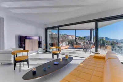 a living room with a couch and chairs at Villa Alba VI4498 by Riviera Holiday Homes in Nice