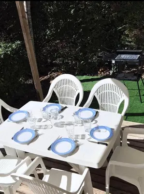 a white table with blue and white plates on it at camping cagne sur mer in Cagnes-sur-Mer