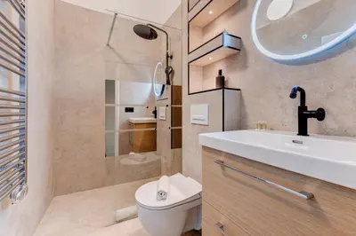 a bathroom with a toilet and a sink and a shower at Vieille Ville - parking, 5 pers, AC, WIFI in Nice