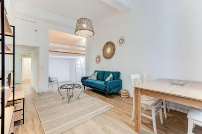 a living room with a blue couch and a table at Vieille Ville - parking, 5 pers, AC, WIFI in Nice