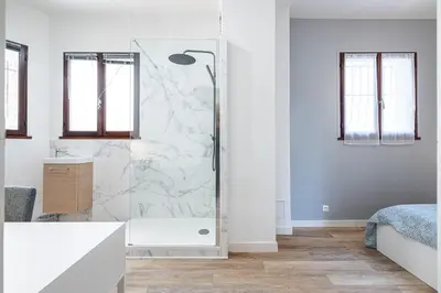 a white bathroom with a shower and a sink at Chambre privée 1 personne BAIL MOBILITE in Nice