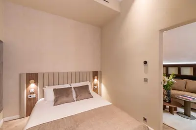 a bedroom with a bed and a couch at 2BDR 6P central A C apt - heart of Nice - Beach in Nice