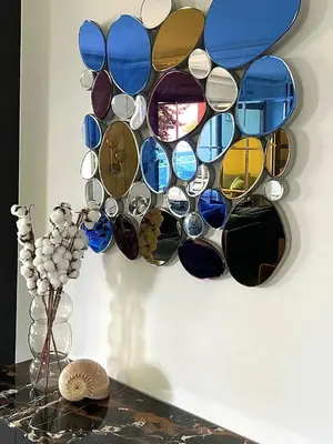 a bunch of sunglasses hanging on a wall at La Vigie in Nice