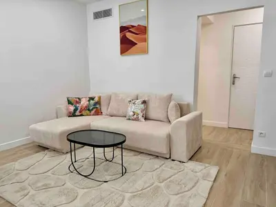 a living room with a couch and a table at Nikaia Residence - 2BR Central Nice Close to Everything in Nice
