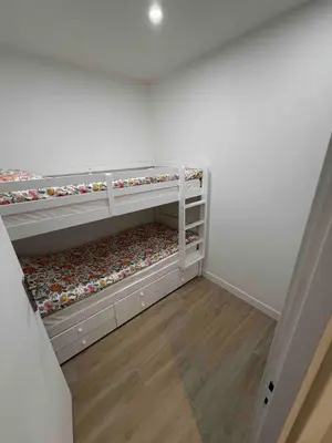a white room with three bunk beds in it at Nikaia Residence - 2BR Central Nice Close to Everything in Nice