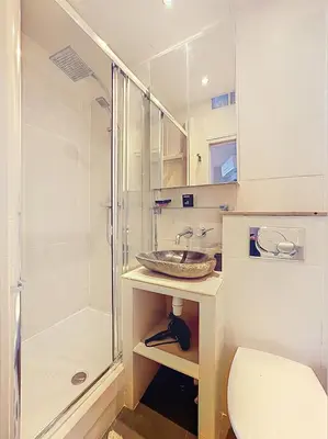 a bathroom with a sink and a shower and a toilet at Calm & Cozy Cocoon Place Masséna Downtown in Nice