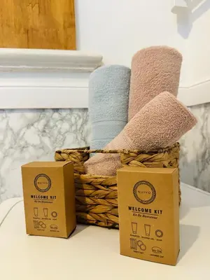 two wicker baskets sitting on a table with towels at Studio Azur in Nice