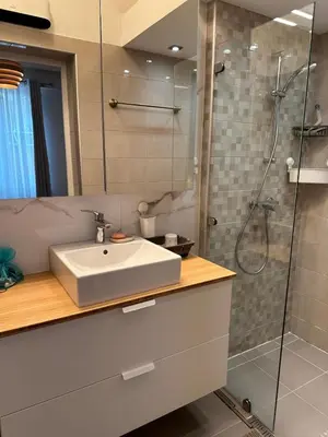 a bathroom with a sink and a shower at A Sweet Escape for Two in Nice