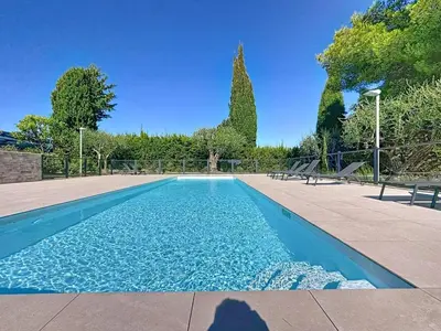a shadow of a person taking a picture of a swimming pool at Comfort and relaxation and swimming pool in Nice