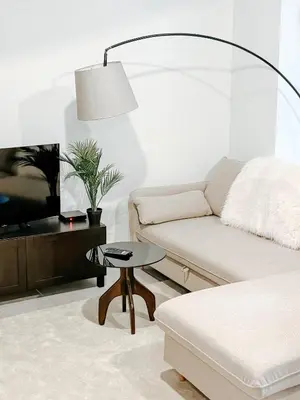 a living room with a couch and a table at Aya - Renovated air-conditioned duplex with garden in Nice
