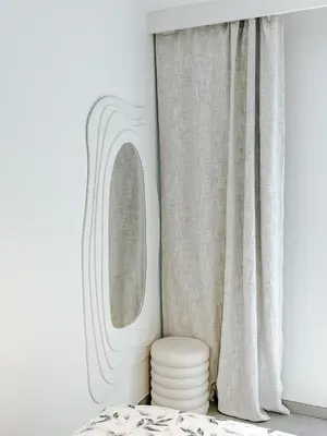 a bedroom with a mirror next to a window at Aya - Renovated air-conditioned duplex with garden in Nice