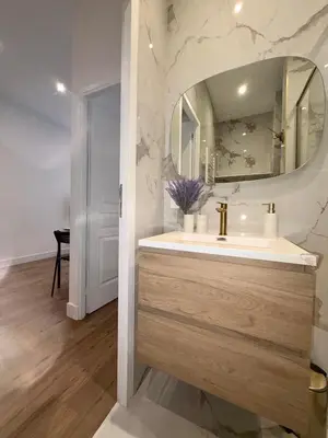 a bathroom with a sink and a mirror at BLUE SKY Apartment in Nice