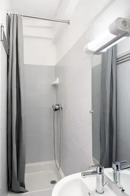 a bathroom with a shower and a sink at Charme du Vieux-Nice - cocon lumineux à 100 m de la mer in Nice