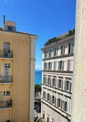a view of the ocean from between two buildings at Vieux Nice bord de mer in Nice