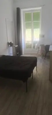 a bedroom with a bed and a window at plein centre Nice magnifique chambre double climatisée in Nice