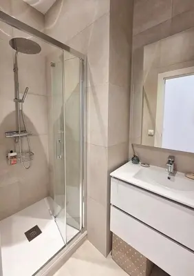 a bathroom with a shower and a sink at Bright Artist's Apartment On Nice Hills in Nice