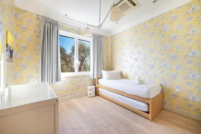 a bedroom with a bed and a tub and a window at Villa Belle Epoque, sea view, pool & hammam in Èze