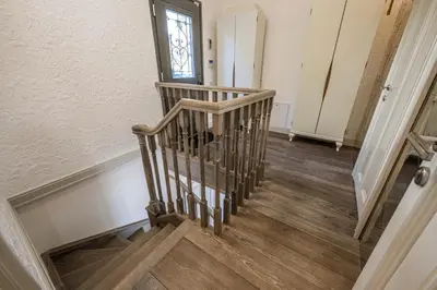 a staircase in a home with wooden floors and a window at Villa Belle Epoque, sea view, pool & hammam in Èze