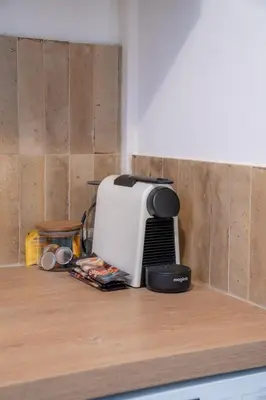 a toaster sitting on top of a kitchen counter at Elegant apartment - Haut Musiciens in Nice