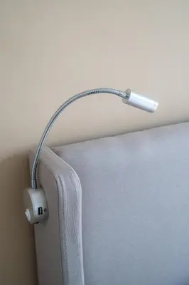 a lamp attached to the side of a couch at Elegant apartment - Haut Musiciens in Nice