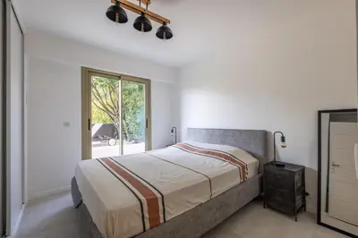 a bedroom with a bed and a window at Cagnes sur mer, 1 bedroom with Garden-Air conditioning-Wifi in Cagnes-sur-Mer