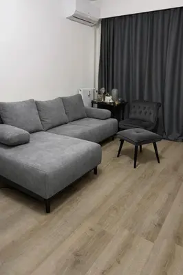 a living room with a couch and a chair at Studio église russe in Nice