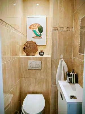 a bathroom with a toilet and a sink at Modern Gem 200m from Beaches with Balcony, AC and Tram in Nice