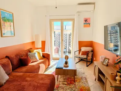 a living room with a couch and a table at Modern Gem 200m from Beaches with Balcony, AC and Tram in Nice