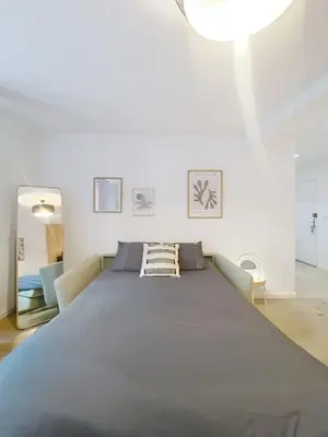 a large bedroom with a large bed in a room at Séjour idéal au cœur du Vieux-Nice in Nice
