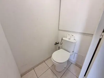 a bathroom with a toilet with two rolls of toilet paper at 4-person apartment - Air conditioning and Pool in Nice