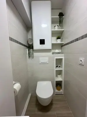 a bathroom with a white toilet and a sink at Studio - Nice Palais des Expositions in Nice