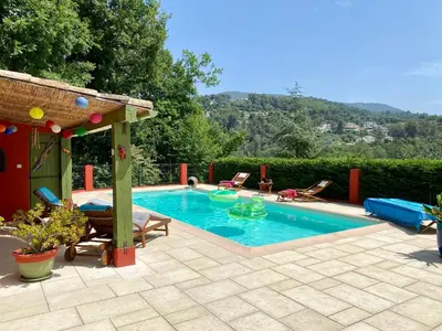 a swimming pool with a gazebo next to at Casa Balija in Tourrette-Levens