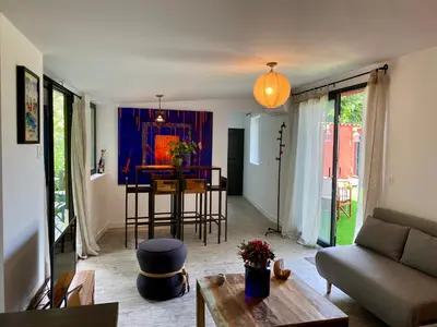 a living room with a couch and a table at Casa Balija in Tourrette-Levens