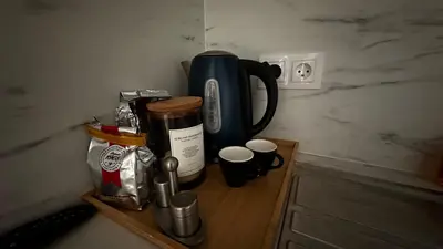 a counter with a coffee pot and cups on it at Appartement elegant a Nice in Nice