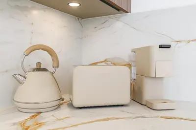 a tea kettle and a toaster on a counter at Appartement Mamabaldi in Nice