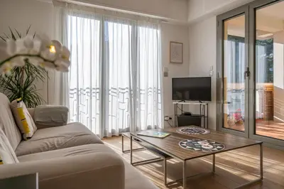 a living room with a couch and a coffee table at flora in Beaulieu-sur-Mer