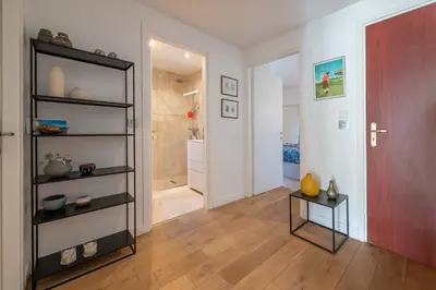 a room with a walk in shower and a black book shelf at flora in Beaulieu-sur-Mer