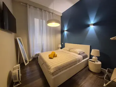 a bedroom with a bed with a teddy bear on it at La Verrière du Vieux Nice in Nice