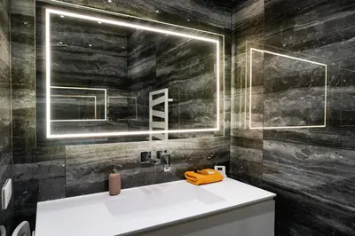 a bathroom with a white sink and a mirror at La Verrière du Vieux Nice in Nice
