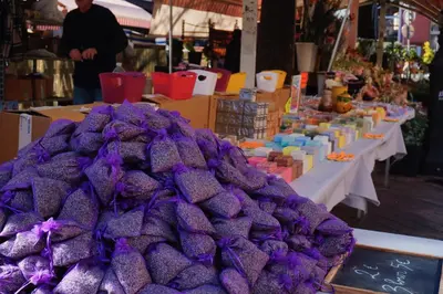 a pile of purple food on display in a market at La Verrière du Vieux Nice in Nice