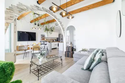 a living room with a couch and a table at MY CASA - EMMANUEL - Cozy apartment with Port view in Nice