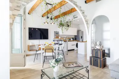 a kitchen and living room with a table and chairs at MY CASA - EMMANUEL - Cozy apartment with Port view in Nice
