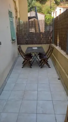 a table and two chairs sitting on a patio at Villa Cornetti in Nice