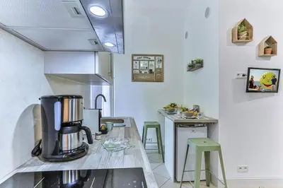 a kitchen with a coffee maker on a counter at GROSSO 1 MD - New 3 minutes from the Sea in Nice