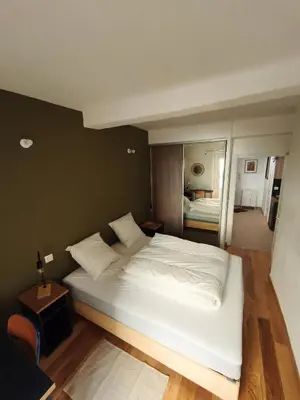 a bedroom with a large white bed and a desk at Cozy 50 m2 - Balcony & Air Conditioning! Heart of Old Nice in Nice