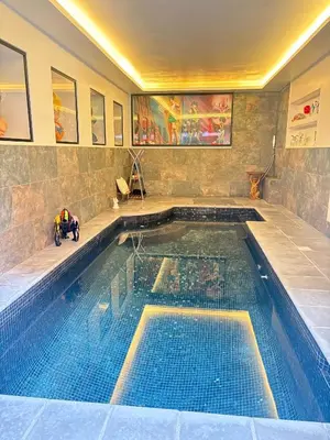 a large swimming pool in a house with a swimming pool at T4 Front de mer Piscine interieure privee Clim in Cagnes-sur-Mer