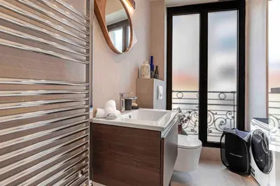 a bathroom with a tub and a toilet and a sink at 10 Félix Faure, Nice in Nice